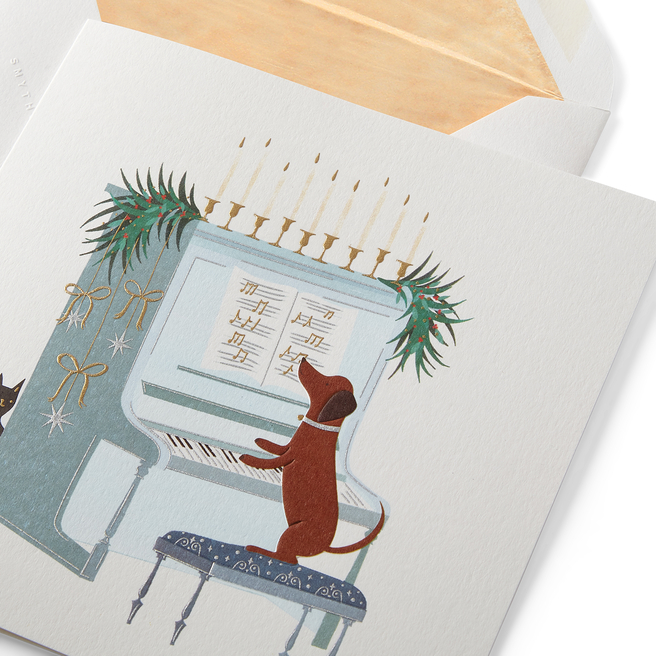 Weihnachtskarten mit klavierspielendem Hund